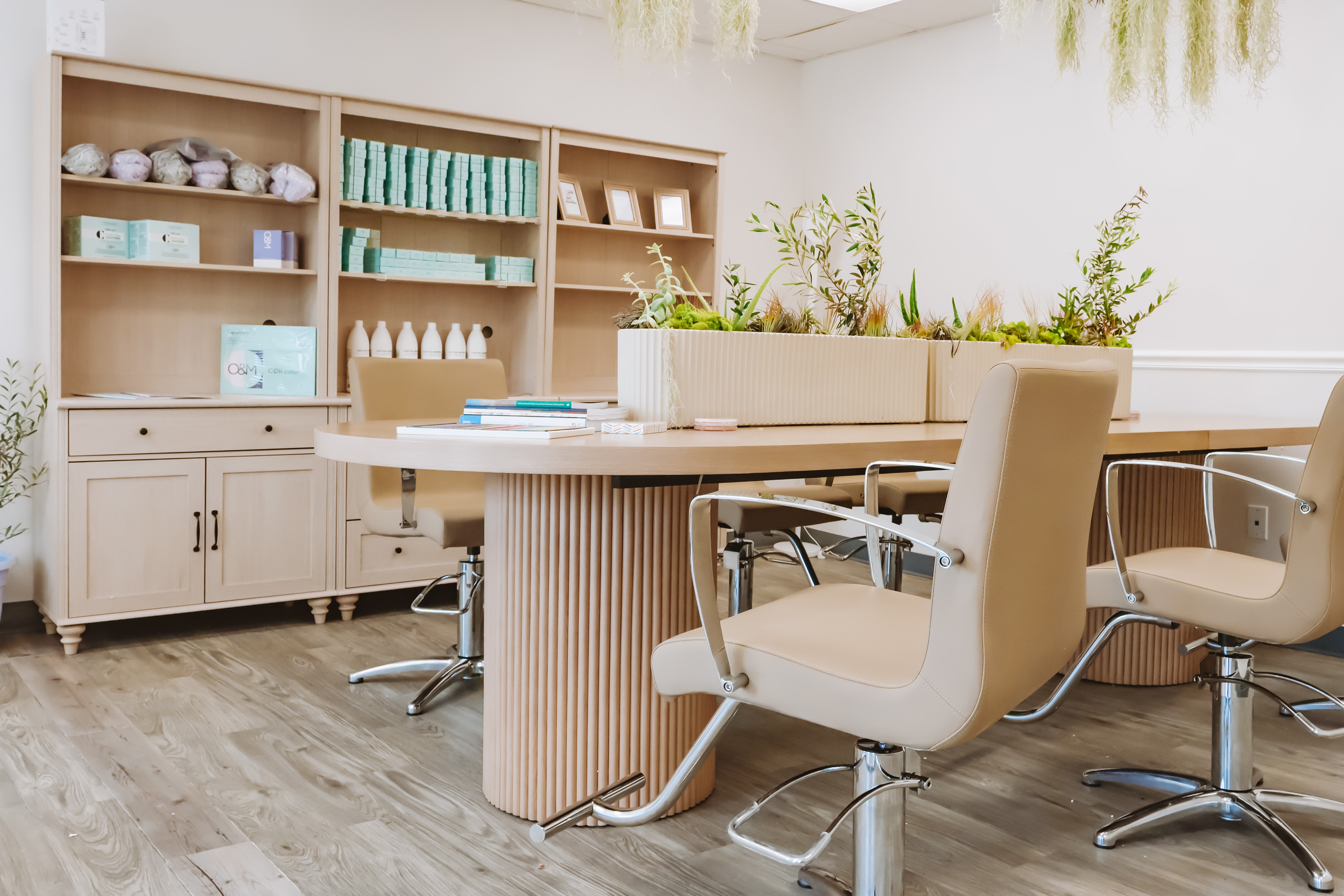 The relaxation and color table at Renovaré, set with books, colored pencils and greenery